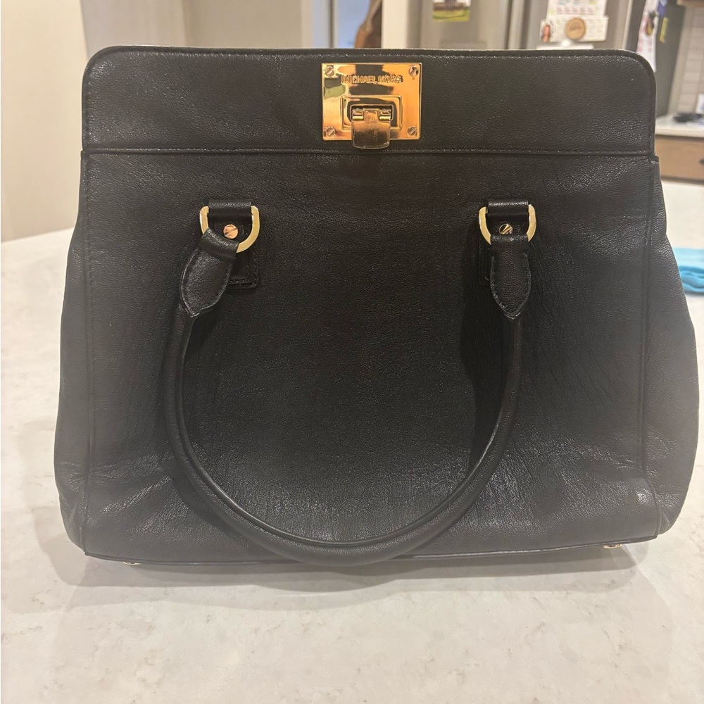Michael Kors, black purse, barely used no wears or tears.